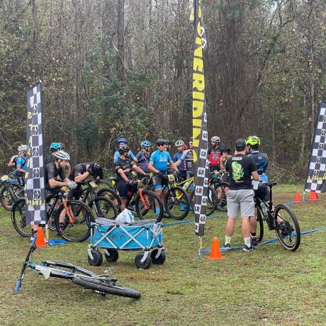 cyclists at starting line in grass