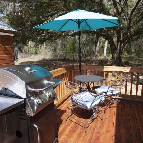 outdoor seating on deck with grill