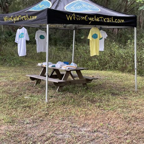 tent with branded shirts hanging